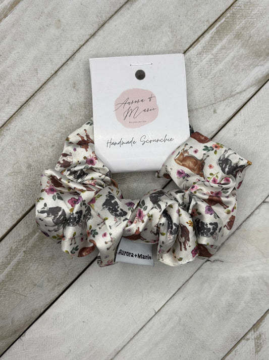 White Cows With Purple Flowers